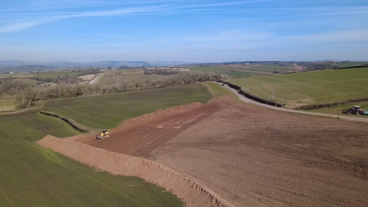 Aerial view of earthworks in a graded rural field