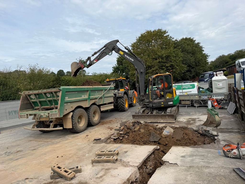 Excavator loading material for muck away