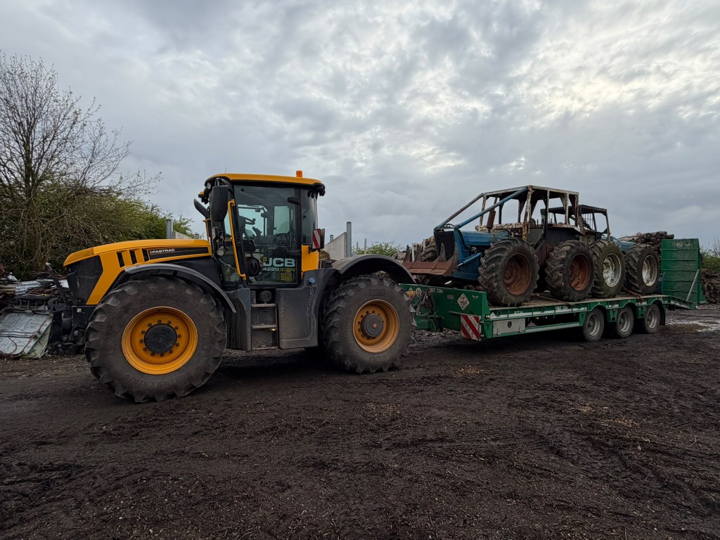 Tractor and low-loader transporting machinery