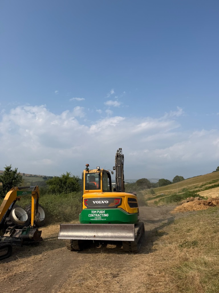 Tracked excavator on a rural site